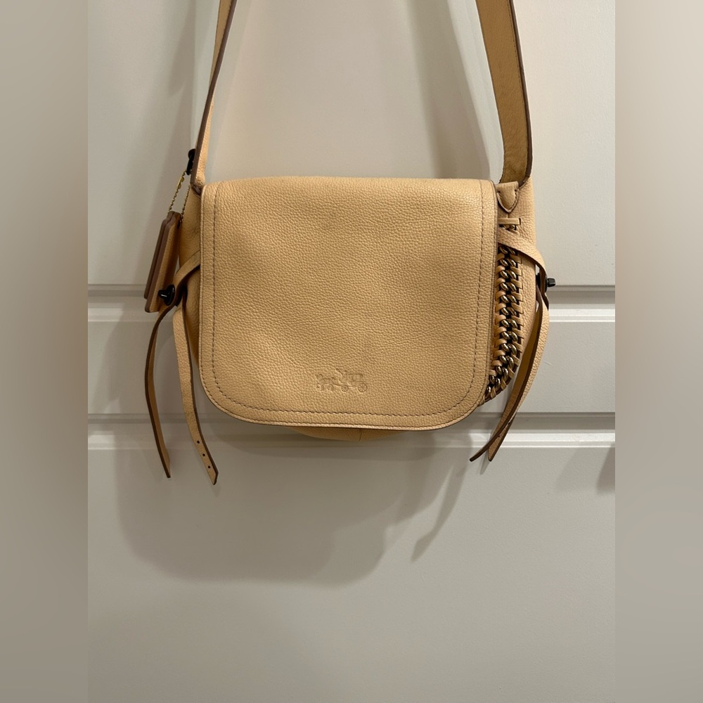 Coach Whipstich Crossbody Flap in a light salmon color